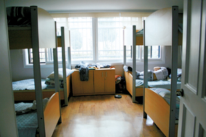 A player naps during break time. Rooms with bunk beds are for second-tier players. 